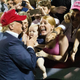 Trump, a baby, and a brutally stoked woman in Mobile Alabama, August 2015. Photo via AP.